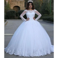 White vintage lace applique wedding dress with long sheer sleeves and voluminous skirt for bridal wear