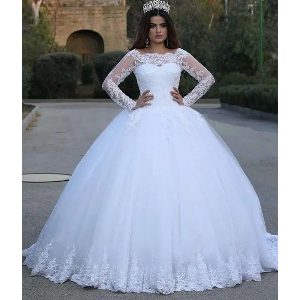White vintage lace applique wedding dress with long sheer sleeves and voluminous skirt for bridal wear