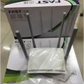 White plastic wireless home broadband router with four silver antennas and a perforated front panel for broadband telecommunications