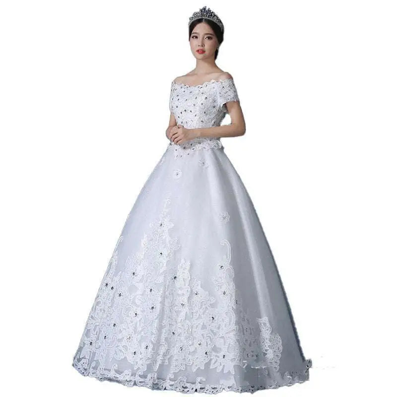 White off-the-shoulder wedding gown with intricate lace detailing and elegant beaded embellishments for weddings