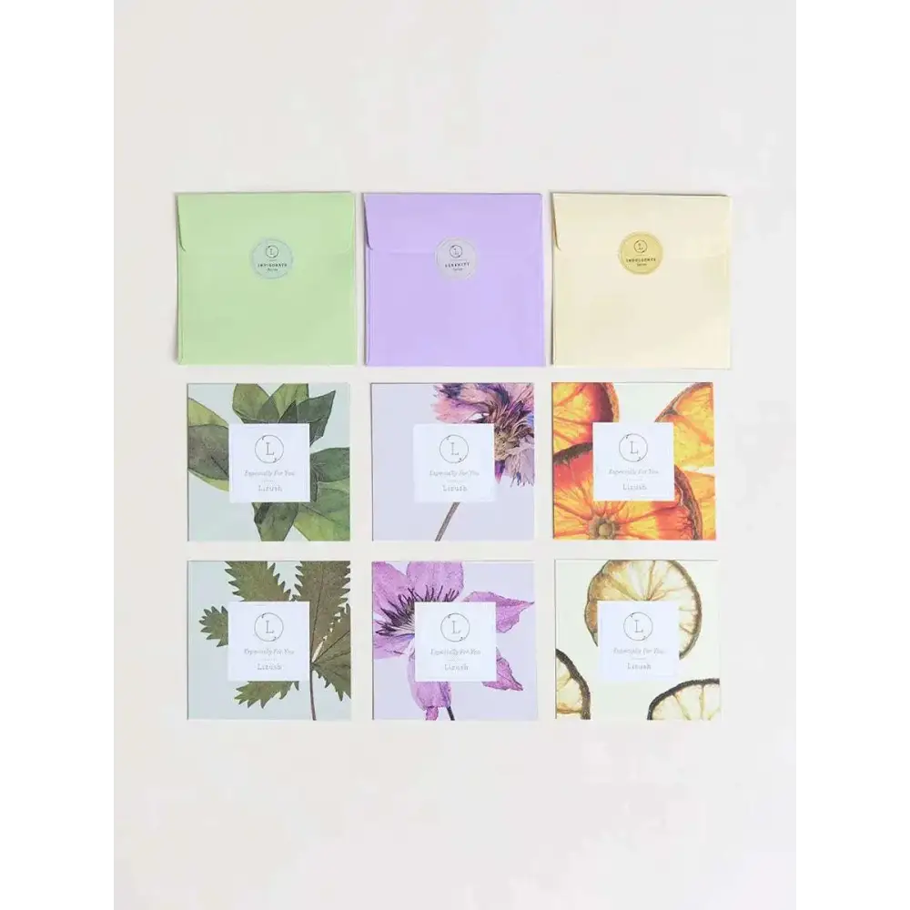 Set of six natural body scrub sachets in pastel green lavender and cream with botanical prints and natural ingredients
