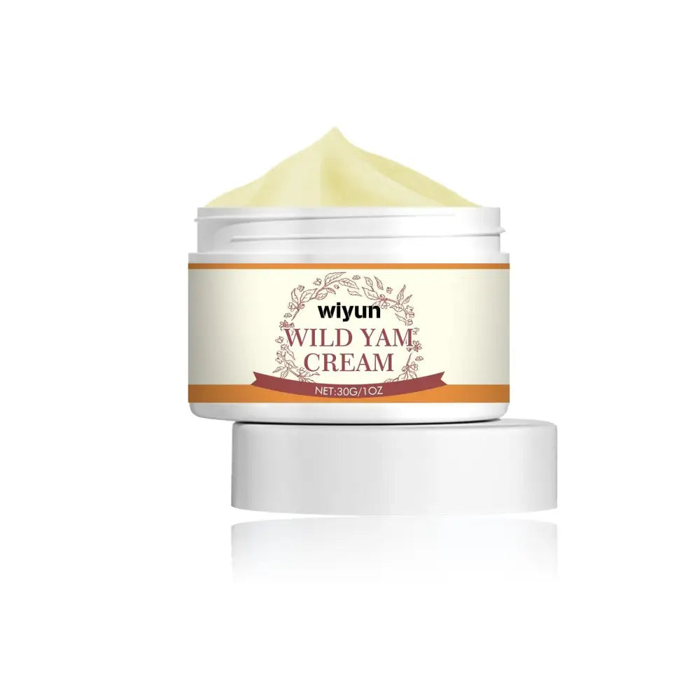 A white cylindrical jar of wiyun wild yam anti aging face cream with beige label and pale yellow cream inside