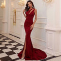 A sleek wine red one shoulder solid color mermaid annual meeting dress with a high slit and elegant fit