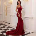 Wine red one shoulder solid color mermaid annual meeting dress with halter neckline and long train in form-fitting fabric