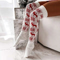 White knit over-the-knee christmas thigh-high stockings with red reindeer and snowflake patterns for winter christmas warm look
