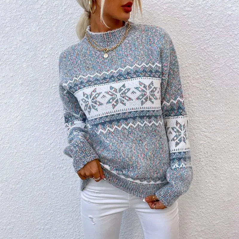 A cozy heathered gray knit winter snowflake sweater with a festive white pattern and half turtleneck design