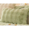 Winter thickened rabbit plush sofa cushion in soft light green faux fur with a thickened textured surface and rounded edges