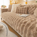 Beige faux fur sofa cover with a thickened rabbit plush texture and matching pillows for winter comfort
