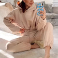 Beige winter two piece sets women tracksuit featuring cropped hoodie and matching jogger pants for casual wear