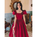 A wine red satin engagement dress with puffed short sleeves and a square neckline with beaded detailing