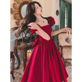 A winter wine red satin engagement dress with puffed sleeves square neckline and pearl embellishments on fitted bodice