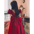 Winter wine red satin engagement dress with puffed sleeves, square neckline, and large elegant back bow shown from the back