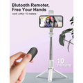 White wireless bluetooth selfie stick tripod with extendable pole and led light holding an iphone for photo-taking