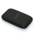 Black textured rectangular wireless CarPlay box adapter with subtle silver logo and USB port for original car integration