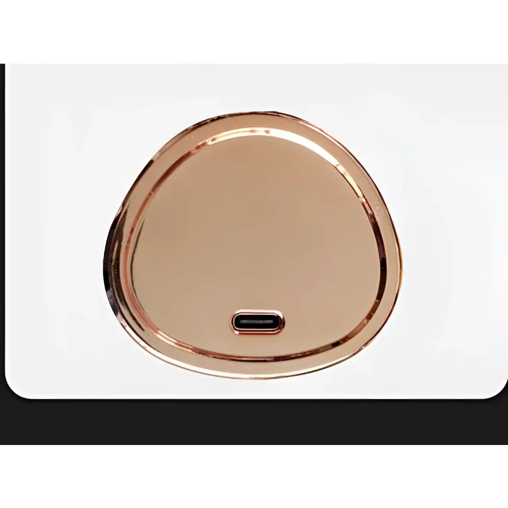Rose gold wireless rechargeable curling iron charging pad with oval metallic finish and centered type-c port