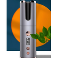 Wireless rechargeable curling iron with silver cylindrical design, digital display, and rose gold accents for styling