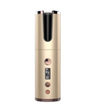 Gold-colored wireless rechargeable curling iron with cylindrical design, metallic finish, and digital display for styling