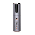 Wireless rechargeable curling iron in gray and rose gold with cylindrical design and digital temperature display