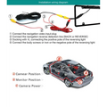 Black wireless smartphone car rearview camera with yellow and red wiring connectors for american frame license plate installation