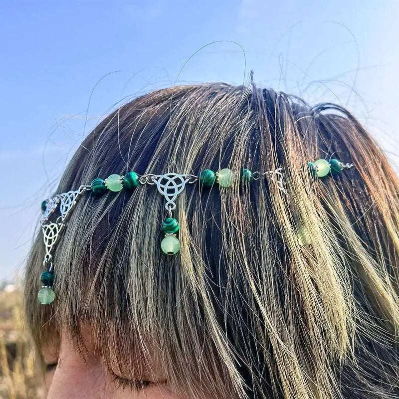 A delicate silver celtic witchcraft irish knot pagan headpiece with green malachite and jade beads and dangling charms