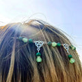 A silver celtic witchcraft irish knot pagan headpiece with green jade beads and intricate knotwork charms