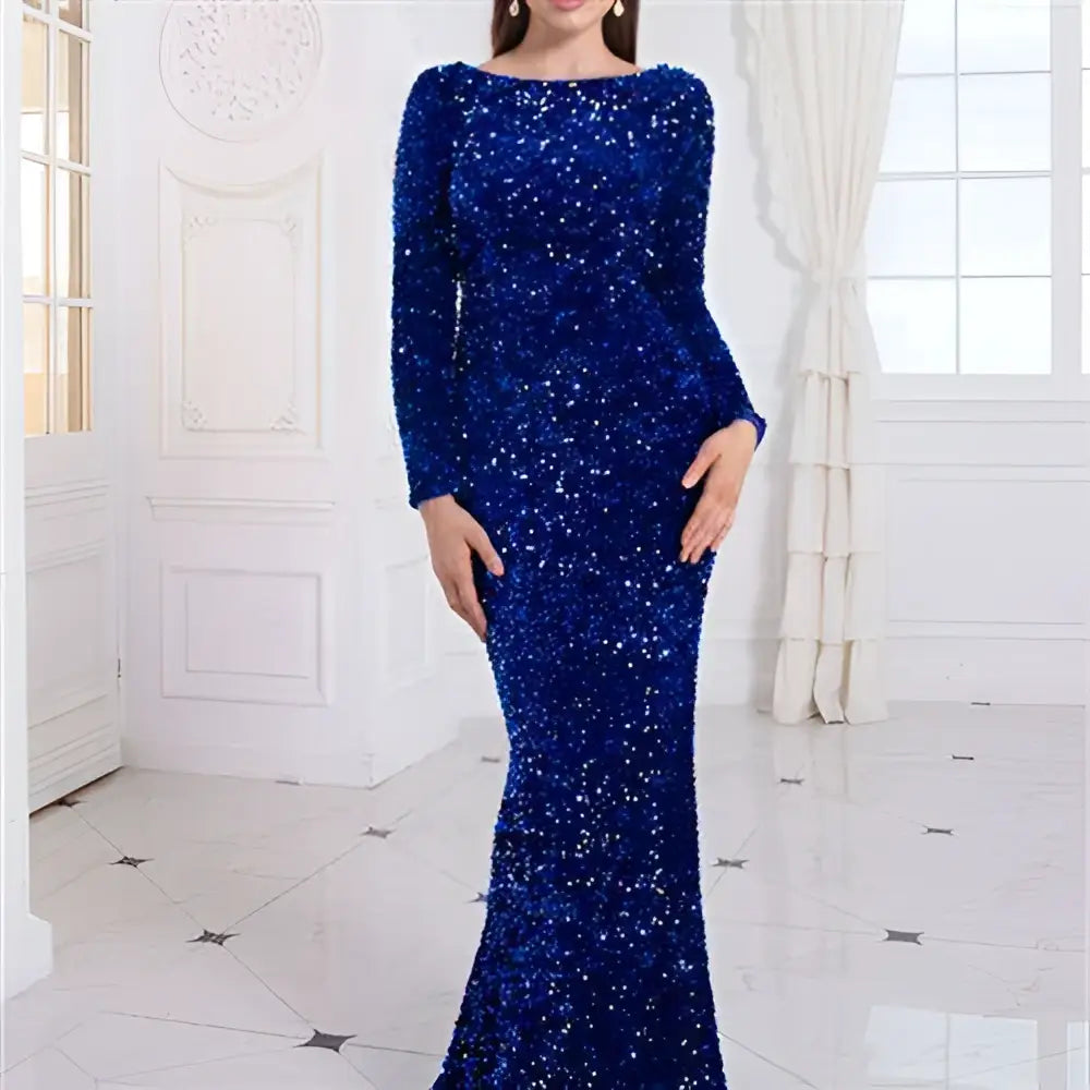 A modest stretch sequin royal blue evening gown with fitted silhouette long sleeves and off the shoulder neckline