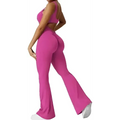 A vibrant fuchsia women sleeveless flare fitness yoga set with crop top and high-waisted flared leggings in stretchy fabric