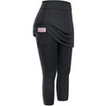 Black women tennis skirted leggings with draped skirt overlay and side pocket holding a phone for active use