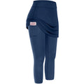 Navy blue women tennis skirted leggings with draped skirt overlay and side pocket for convenient storage