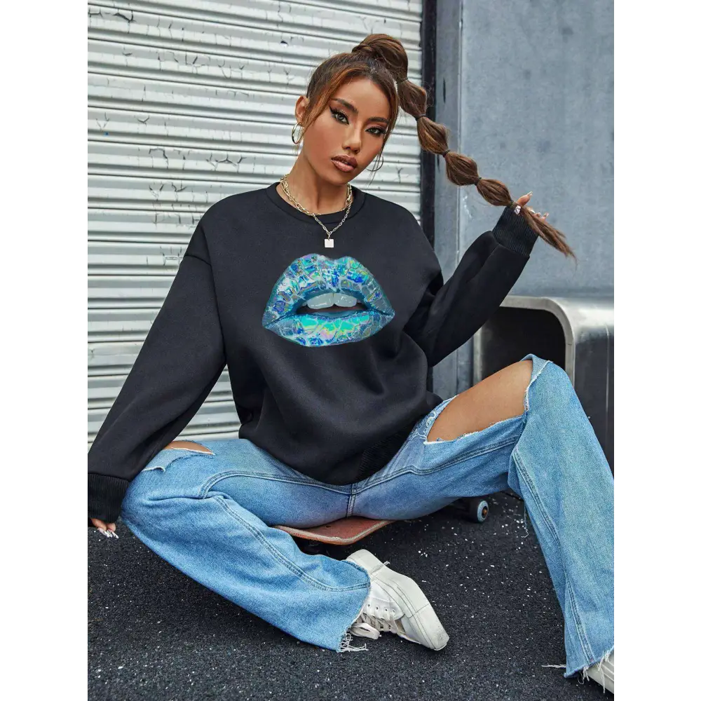 Black long sleeve sweatshirt for women featuring a vibrant iridescent blue lips graphic on the front
