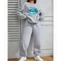 Women’s long sleeve sweatshirt in gray featuring a large vibrant blue lips graphic on the front