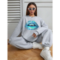 Gray oversized long sleeve sweatshirt for women featuring a bold iridescent blue lips graphic design