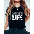 Black short-sleeved women’s camping life graphic t-shirt with white camping life graphic featuring tree campfire and rv icons
