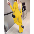 Black chain-strap handbag with sleek rectangular body paired with casual sleeveless jumpsuit with flattering fit silhouette