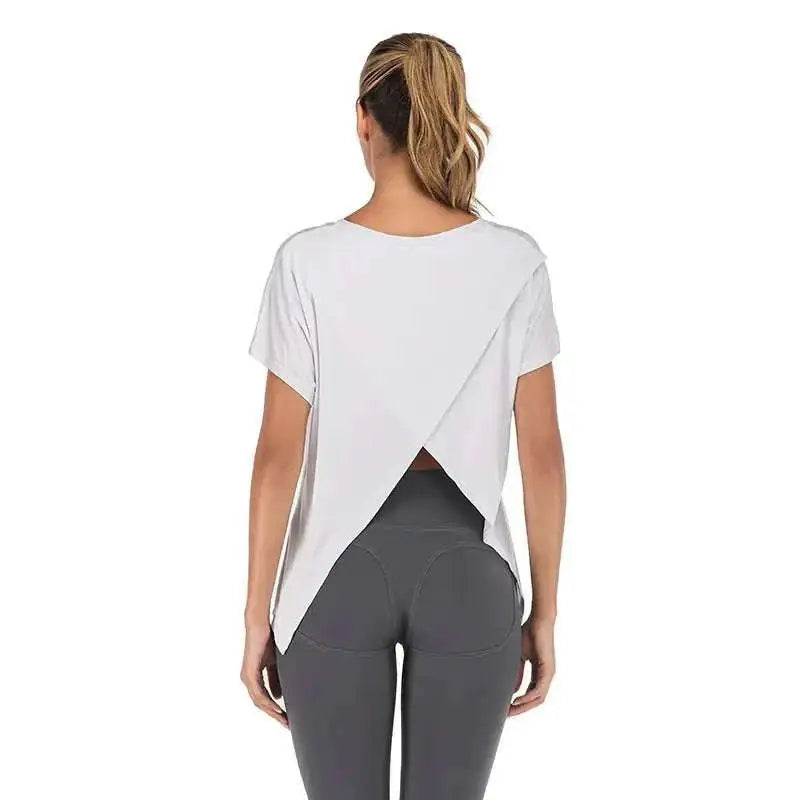 Women’s heather gray v-neck sports t-shirt with a relaxed fit and asymmetrical open back design visible from the back side