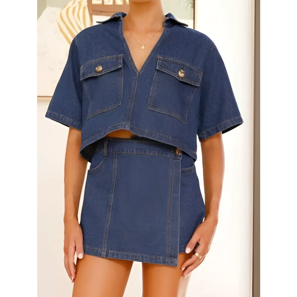 Women’s irregular denim short pantskirt suit featuring blue denim cropped shirt with pockets and matching mini skirt