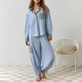 Women’s light blue striped pajama set with pink muted plaid chest pocket and cuffs in dressing gown plaid style
