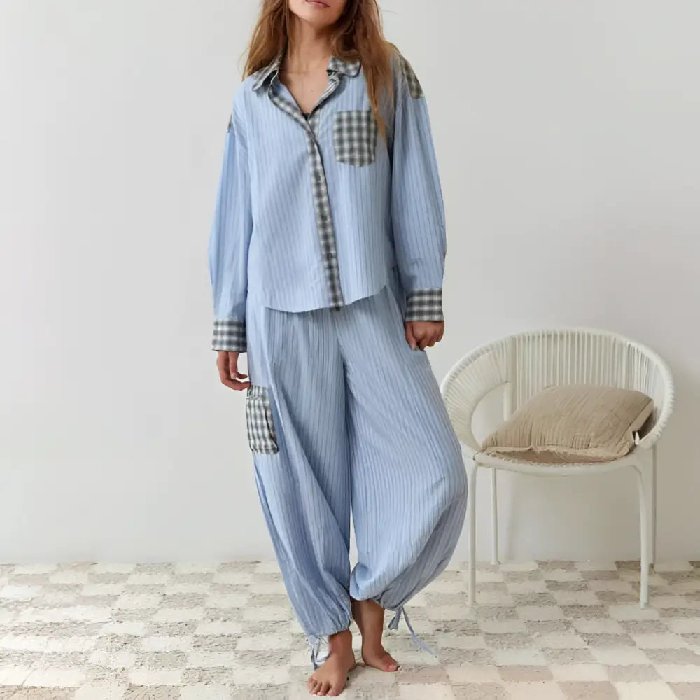 Women’s light blue striped pajama set with pink muted plaid chest pocket and cuffs in dressing gown plaid style