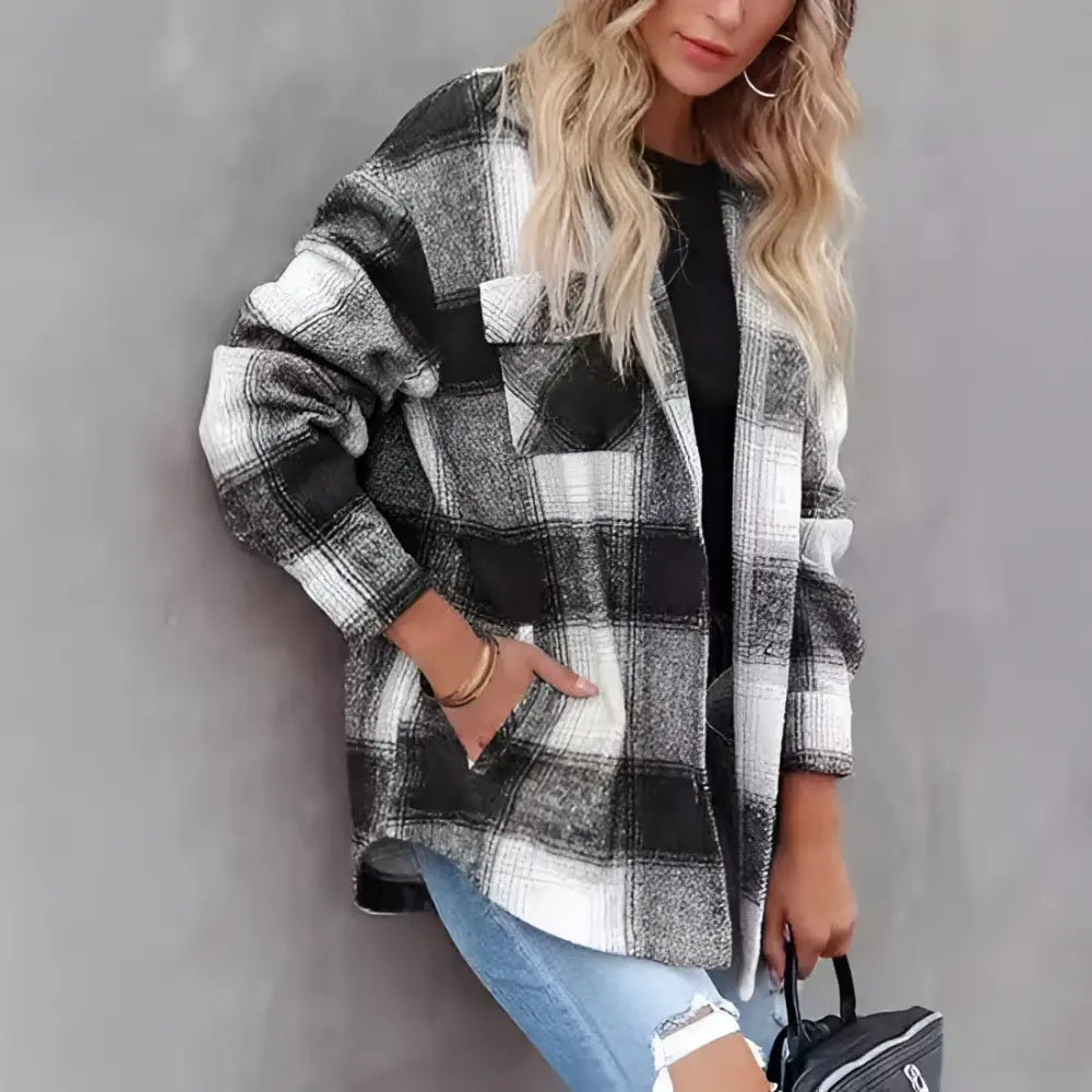 Women’s plaid buckle long sleeve jacket in black and white plaid flannel with a relaxed oversized fit