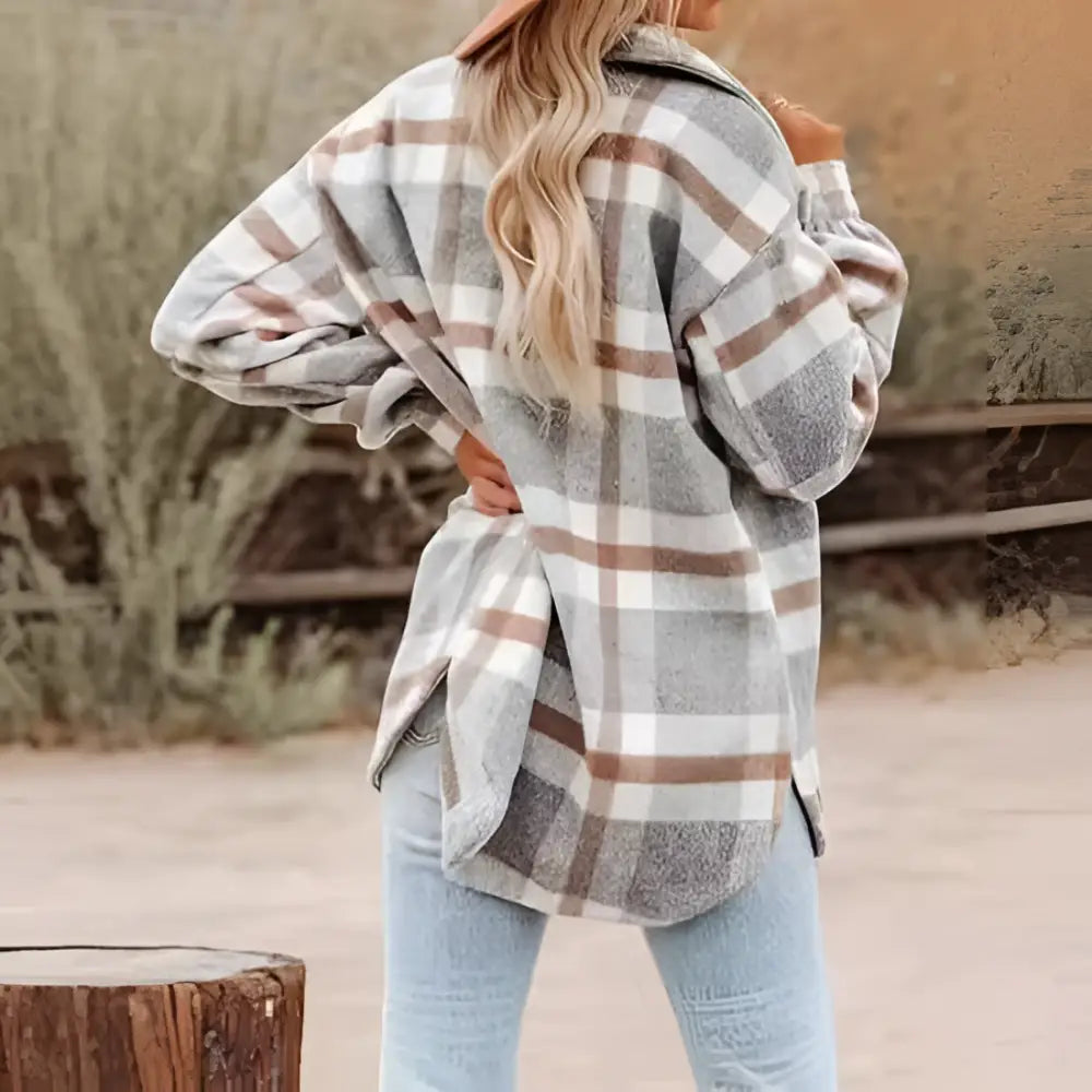Women’s plaid buckle long sleeve jacket in black and white plaid flannel with a relaxed oversized fit
