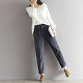 Women’s plus size dark blue corduroy casual trousers with a relaxed fit and rolled cuffs in dark gray corduroy material