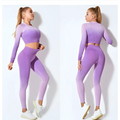 Women’s seamless gradient long sleeve yoga set in purple featuring a crop top and leggings made of stretchy fabric