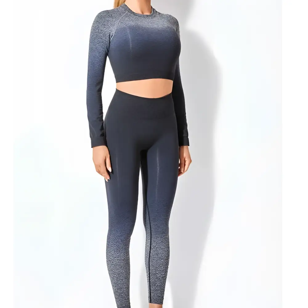 Women’s seamless gradient long sleeve yoga set featuring a dark gray two-piece crop top and high-waisted leggings