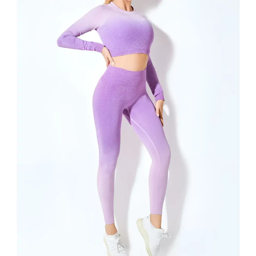 Women’s seamless gradient long sleeve yoga set in lavender featuring a stretchy crop top and leggings made from athletic fabric