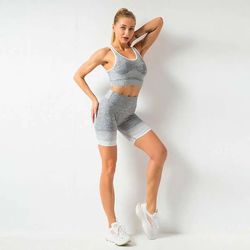 Gray heathered knit women’s seamless yoga two-piece workout set with white trim designed for hip lifting workout