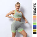 A women’s seamless yoga hip lifting workout set in gray heathered neon green gradient with seamless knit fabric