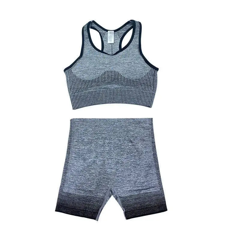 Gray and black heathered women’s seamless yoga two-piece set with ribbed detailing for hip lifting workout