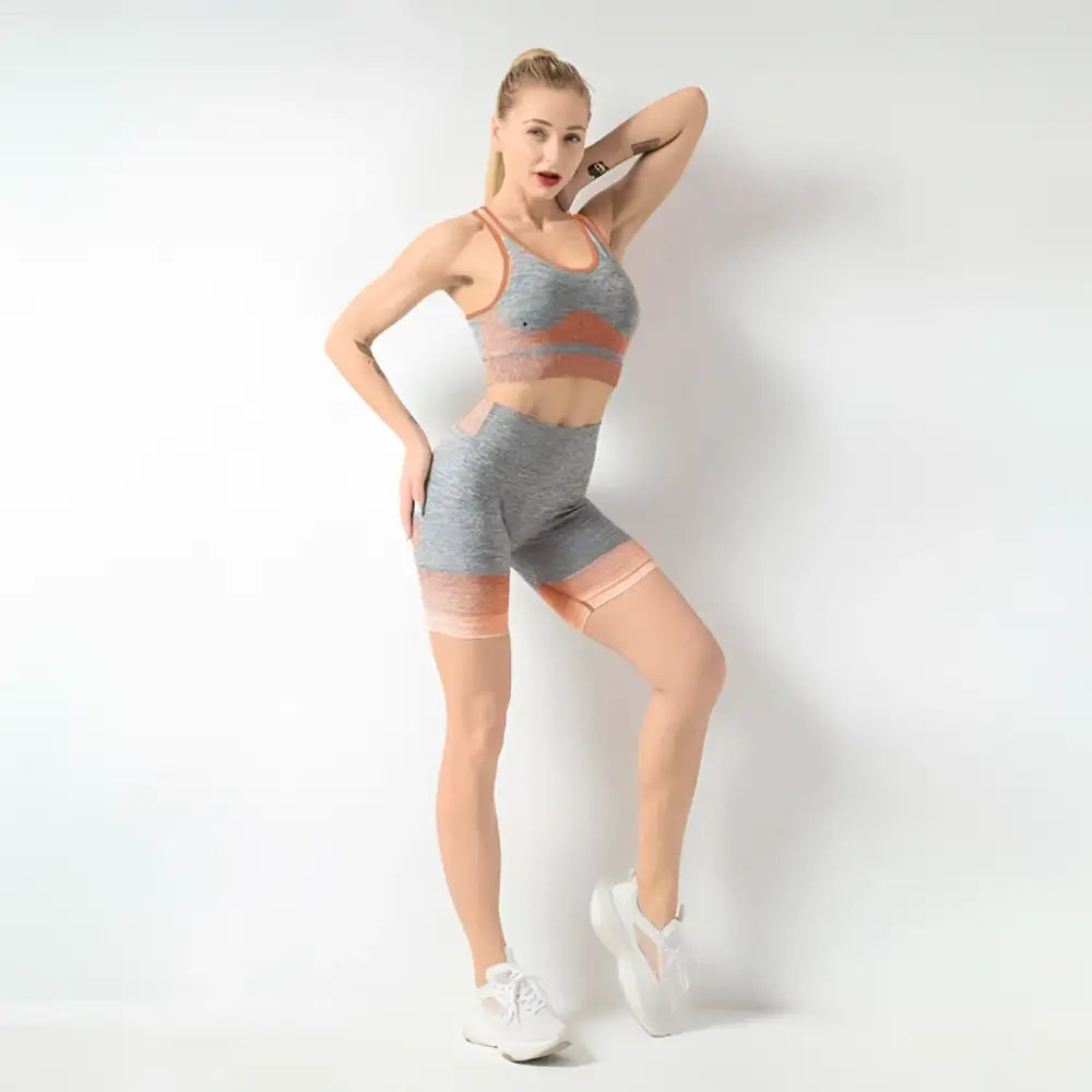 Women’s seamless yoga two-piece set in gray heathered and peach with stretchy fabric for hip lifting workout use