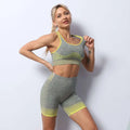 Women’s seamless yoga hip lifting workout set in gray heathered and neon yellow textured knit with matching sports bra and shorts