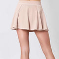 A soft blush pink corduroy pleated skirt with ribbed waistband from women’s solid colour ribbed knit casual suit